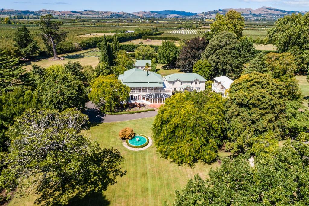 an aerial view of an estate with a mansion at Mangapapa Hotel in Havelock North
