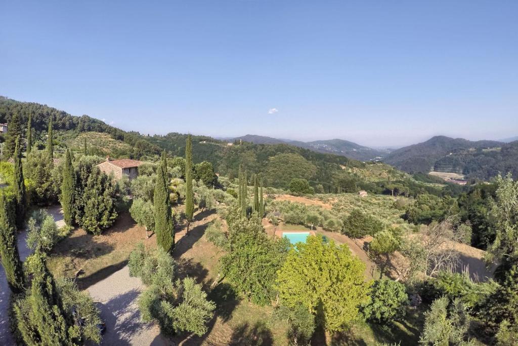 an aerial view of a villa with a river and trees at Villa Sorgente in Santa Maria Albiano