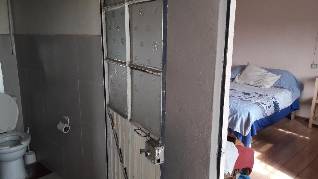 Postel nebo postele na pokoji v ubytování El laberinto hospedaje en casa