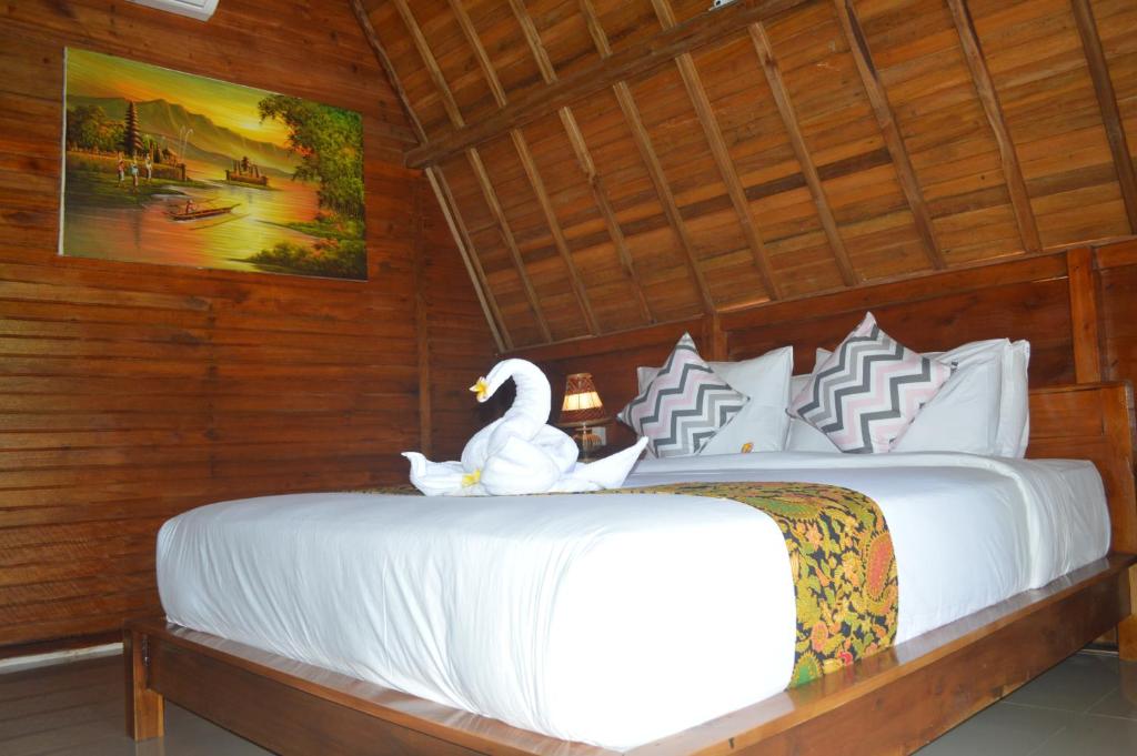Postel nebo postele na pokoji v ubytování Nyuh Gading Bungalow Nusa Penida