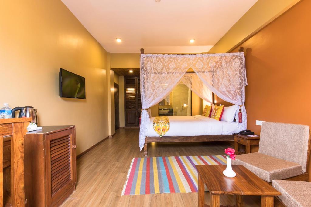 Postel nebo postele na pokoji v ubytování Hotel Mala Pokhara