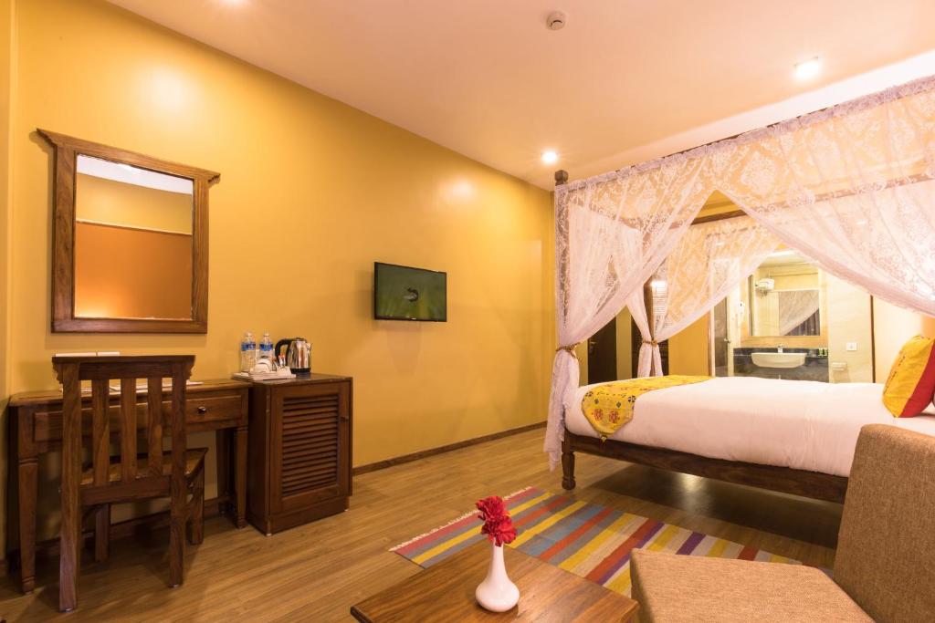 Postel nebo postele na pokoji v ubytování Hotel Mala Pokhara