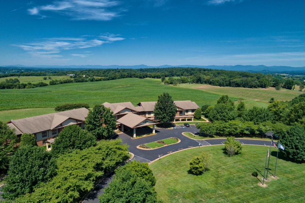 an aerial view of a house in a field at Round Hill Inn in Orange