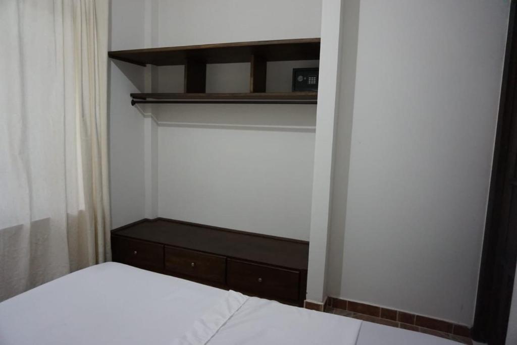 Postel nebo postele na pokoji v ubytování Hostal Suna Vito