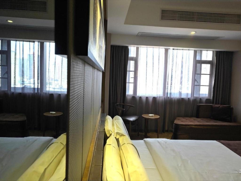 Postel nebo postele na pokoji v ubytování lnsail Hotel Shenzhen Luohu Port Railway Station