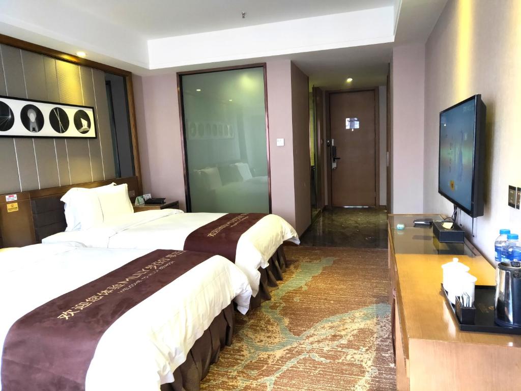 TV a/nebo společenská místnost v ubytování lnsail Hotel Shenzhen Luohu Port Railway Station