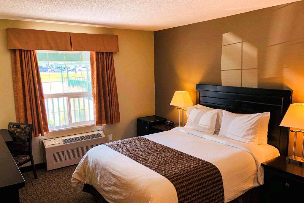 Postel nebo postele na pokoji v ubytování Econo Lodge
