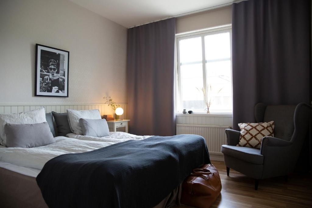 Postel nebo postele na pokoji v ubytování Tyringe Kurhotell