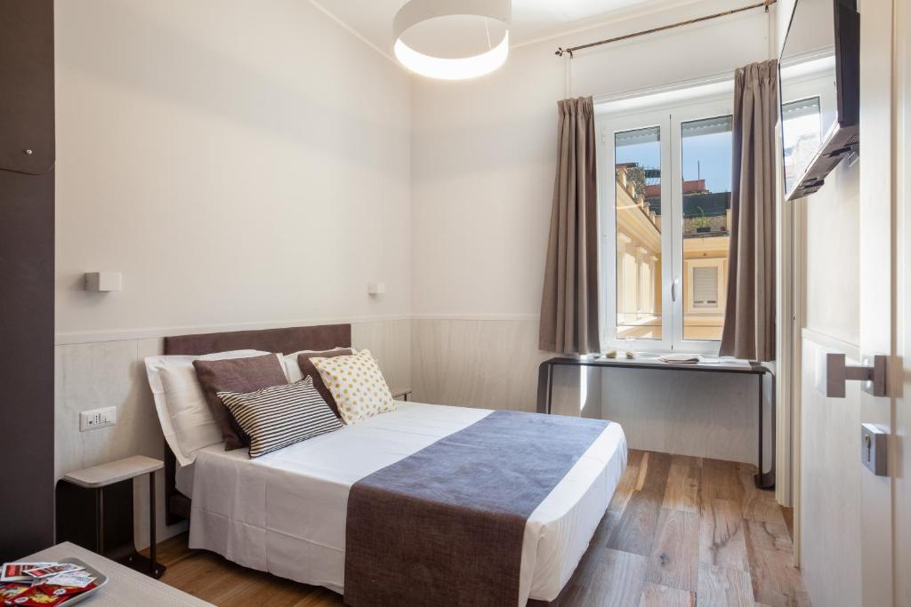 Postel nebo postele na pokoji v ubytování Residenza Cavallini