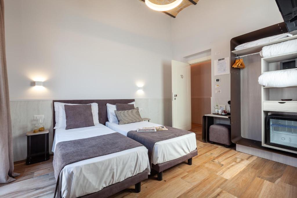 Postel nebo postele na pokoji v ubytování Residenza Cavallini