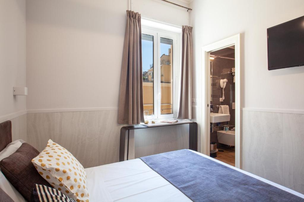 Postel nebo postele na pokoji v ubytování Residenza Cavallini