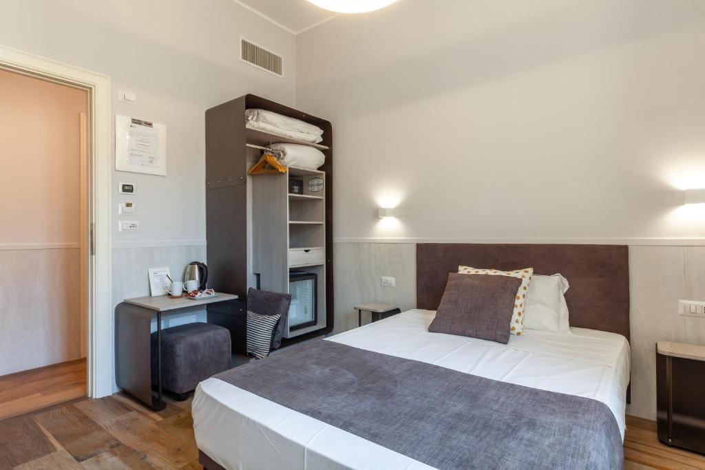 Postel nebo postele na pokoji v ubytování Residenza Cavallini
