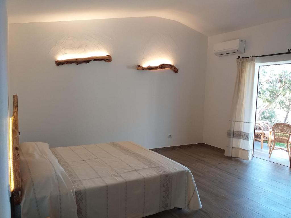 Postel nebo postele na pokoji v ubytování Turismo Rurale Lu Stazzu Arzachena