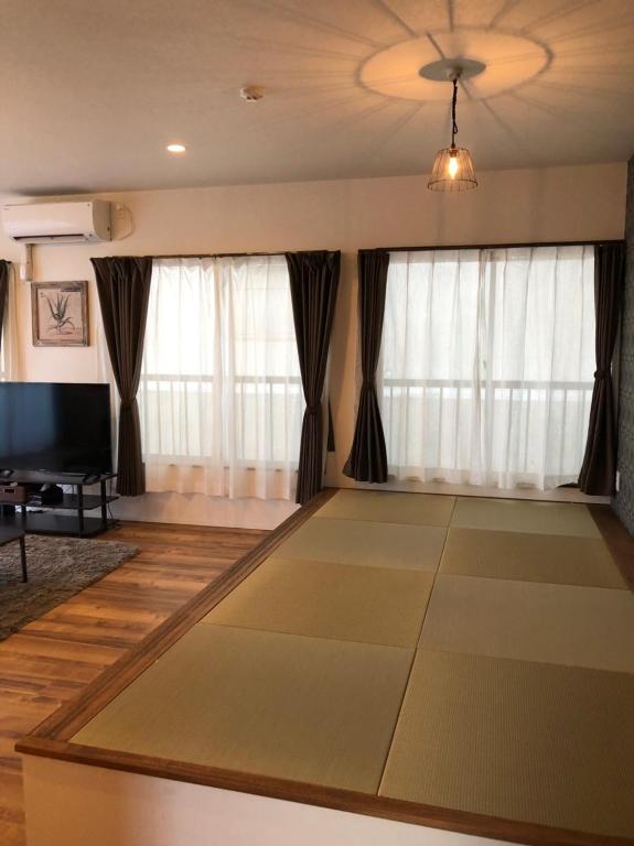 Amami Weekly House Nico Nico Nazeko-ten - Apartment With Balcony