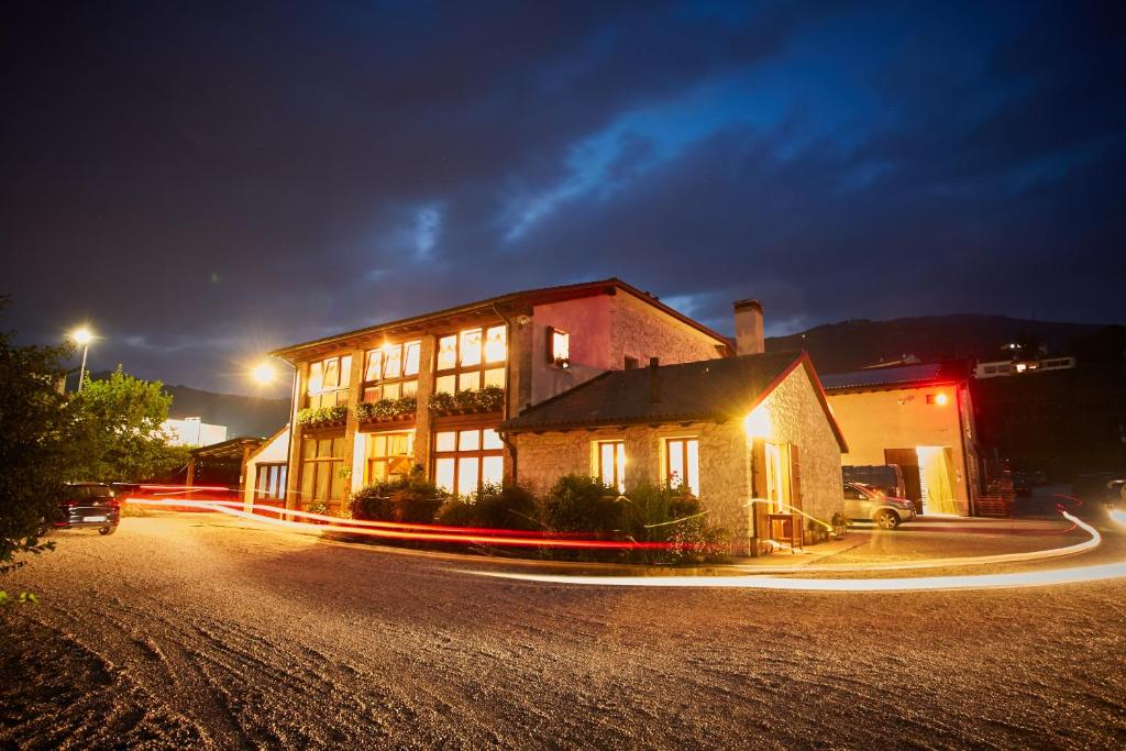 a building on a street at night with light trails at Agriturismo Roccat in Valdobbiadene