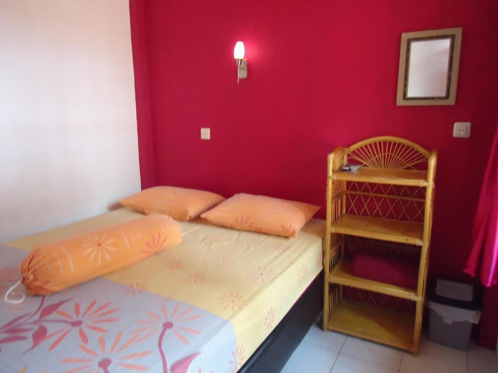 Postel nebo postele na pokoji v ubytování Kancil homestay