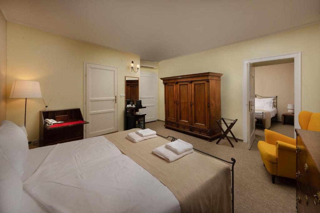 Łóżko lub łóżka w pokoju w obiekcie Hotel Angelo d'Oro