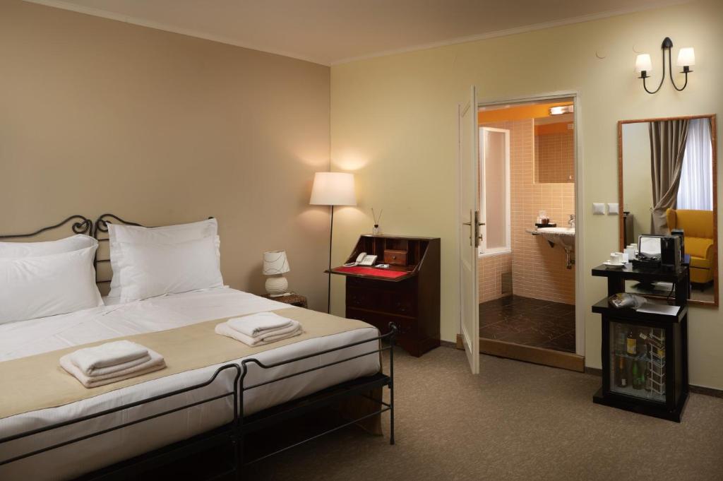 Łóżko lub łóżka w pokoju w obiekcie Hotel Angelo d'Oro