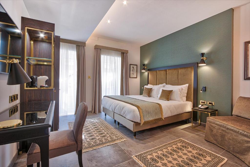 Postel nebo postele na pokoji v ubytování Palazzo Rosaria Boutique Hotel