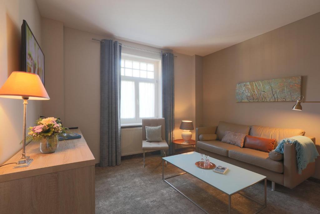 TV a/nebo společenská místnost v ubytování Romantik Hotel am Brühl