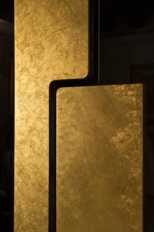 a close up of a gold object with a wall at Hotel Palazzo Giovanelli e Gran Canal in Venice