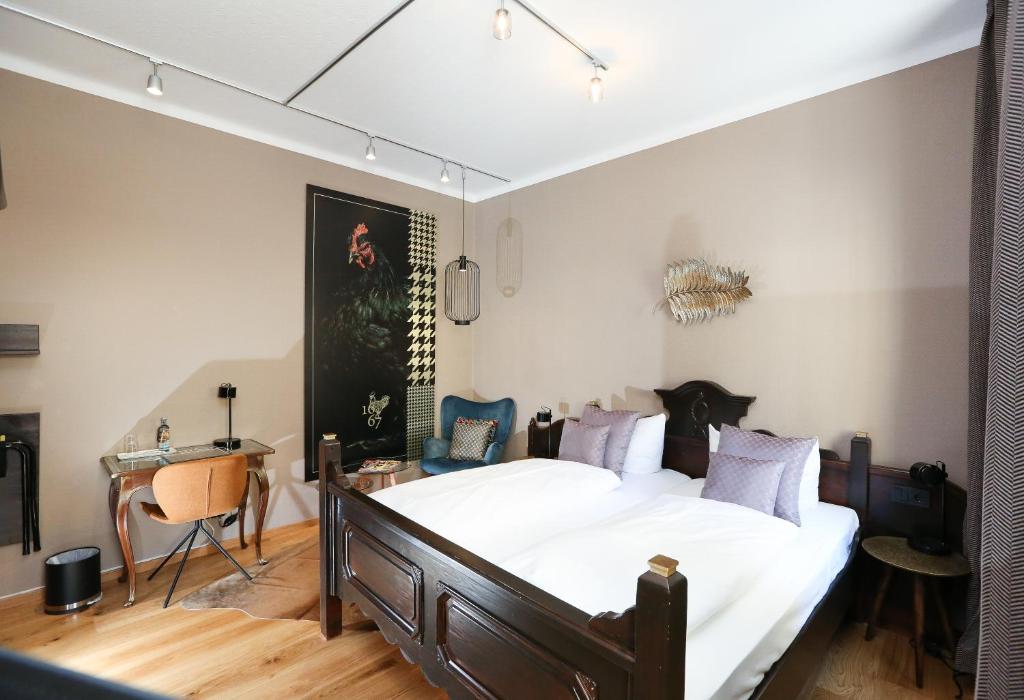 Postel nebo postele na pokoji v ubytování Arthotel ANA Goggl
