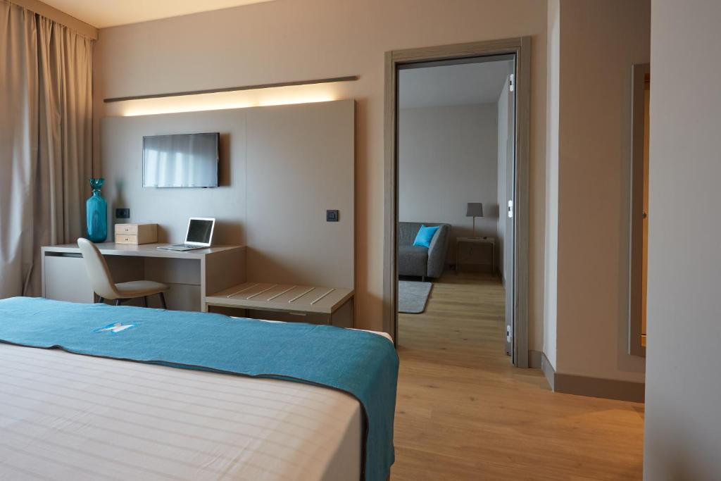 Postel nebo postele na pokoji v ubytování DC HOTEL INTERNATIONAL