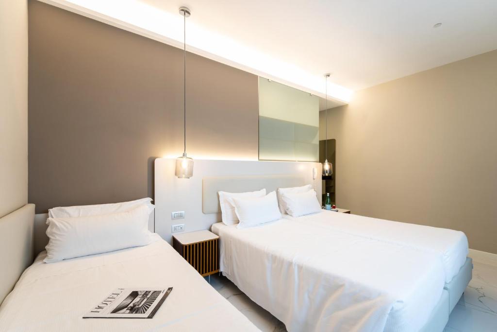 Postel nebo postele na pokoji v ubytování Hotel Milano Castello