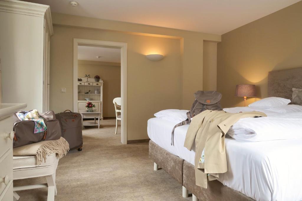Postel nebo postele na pokoji v ubytování Romantik Hotel am Brühl