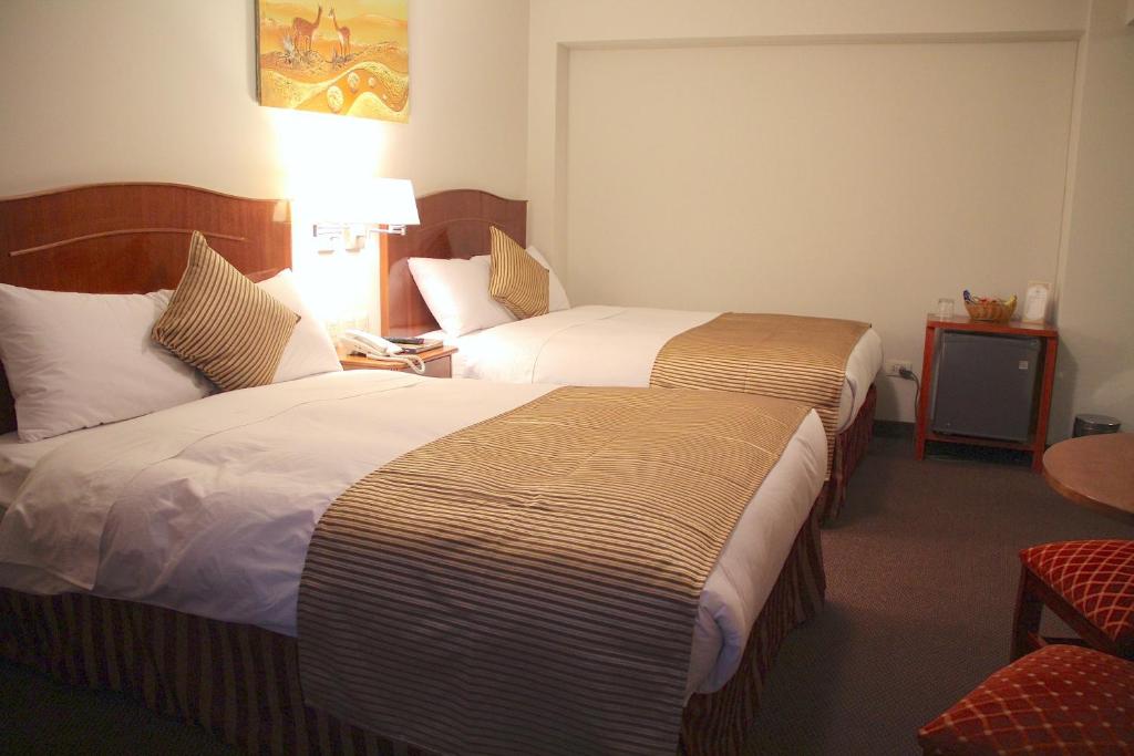 Postel nebo postele na pokoji v ubytování Casona Plaza Hotel Arequipa