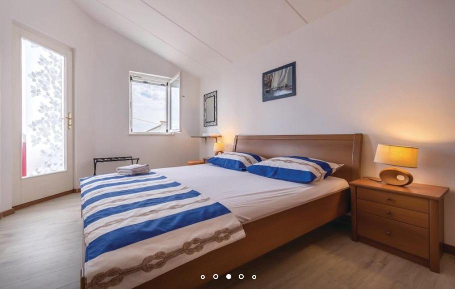 Łóżko lub łóżka w pokoju w obiekcie House Hermes