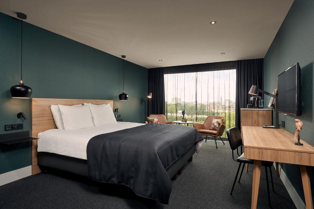 Postel nebo postele na pokoji v ubytování Van der Valk Hotel Antwerpen