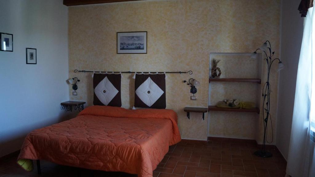 Posteľ alebo postele v izbe v ubytovaní Agriturismo Poggio San Pietro