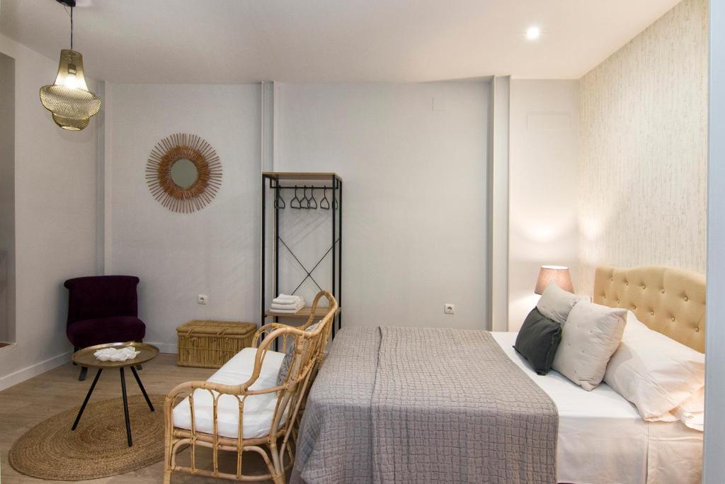 Posteľ alebo postele v izbe v ubytovaní Apartamentos Los Lobos