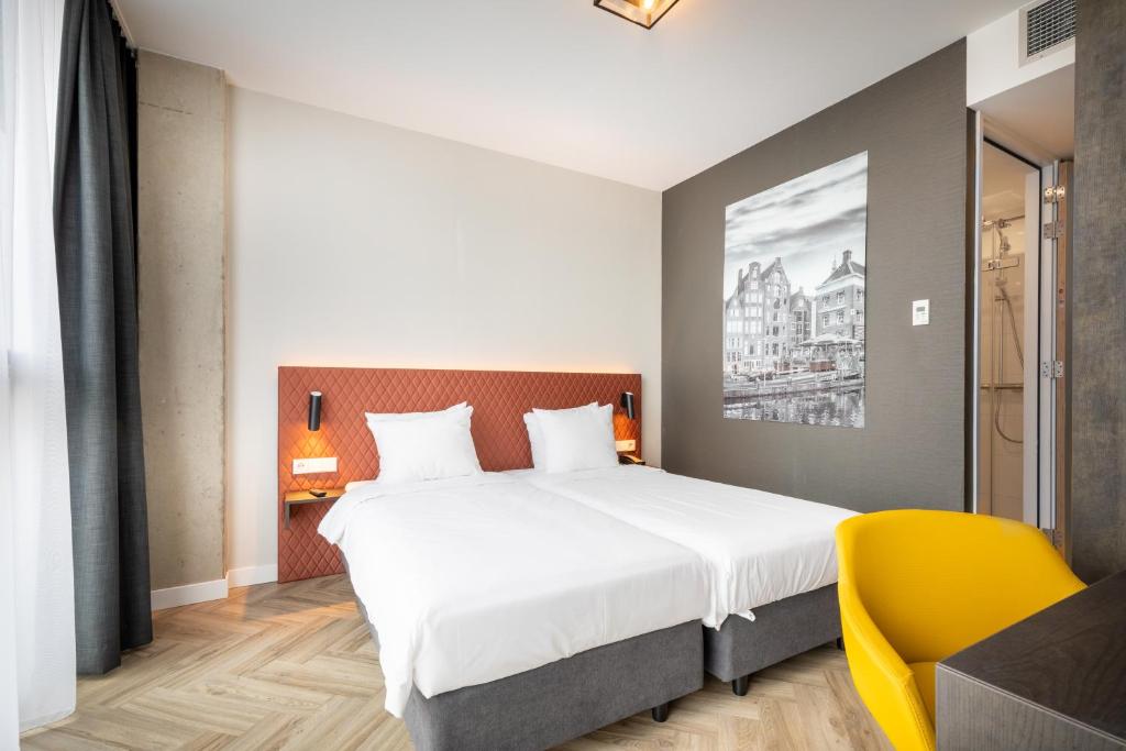 מיטה או מיטות בחדר ב-Hotel New Kit