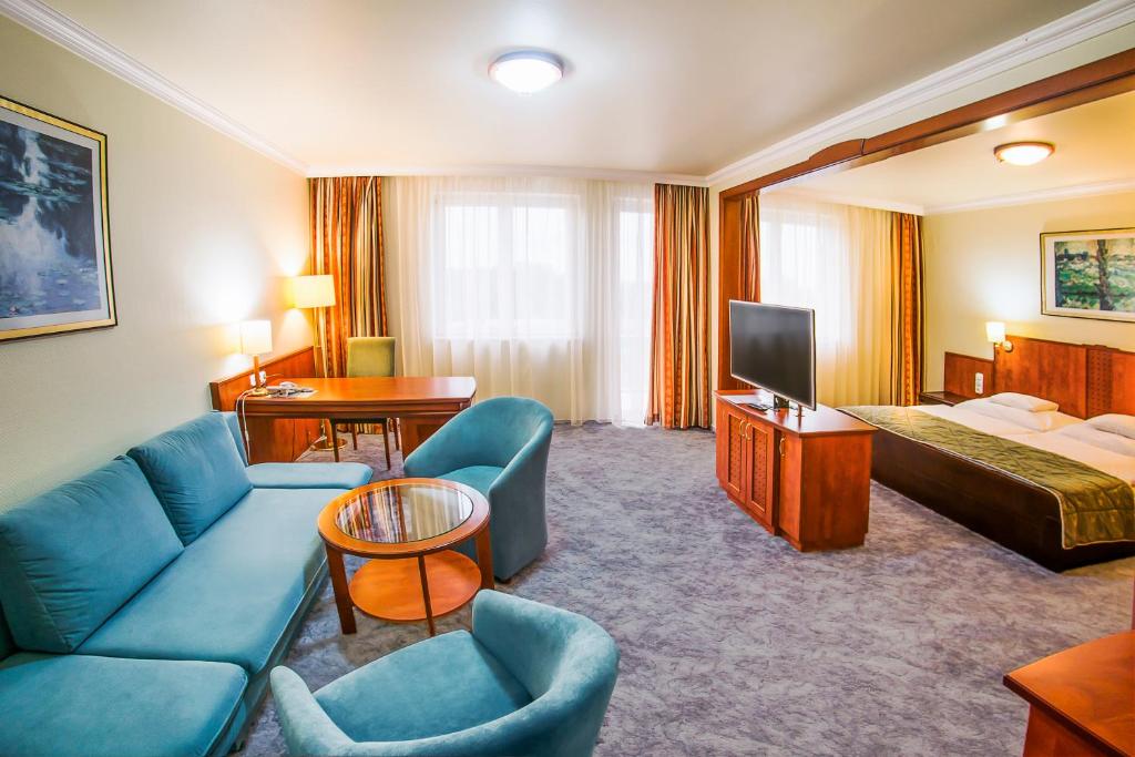 Posteľ alebo postele v izbe v ubytovaní Hotel Silver
