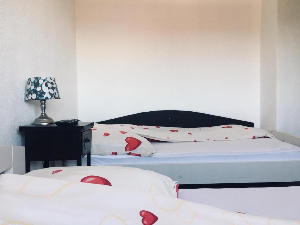 Ein Bett oder Betten in einem Zimmer der Unterkunft Pension Akropolis