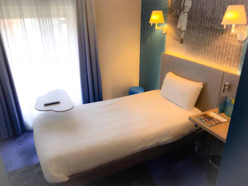 Кровать или кровати в номере ibis Styles Manchester Portland