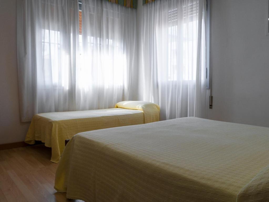Postel nebo postele na pokoji v ubytování Hotel Casa Mia