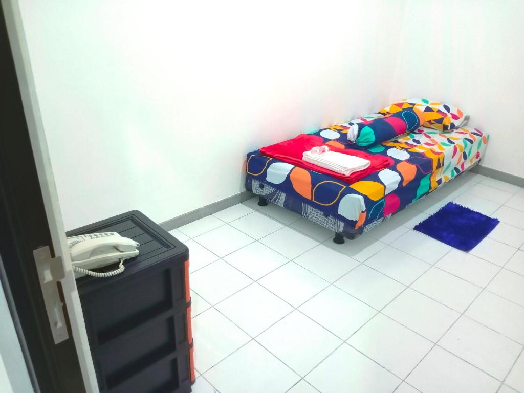 Postel nebo postele na pokoji v ubytování Hotel Nalendra Plaza Subang
