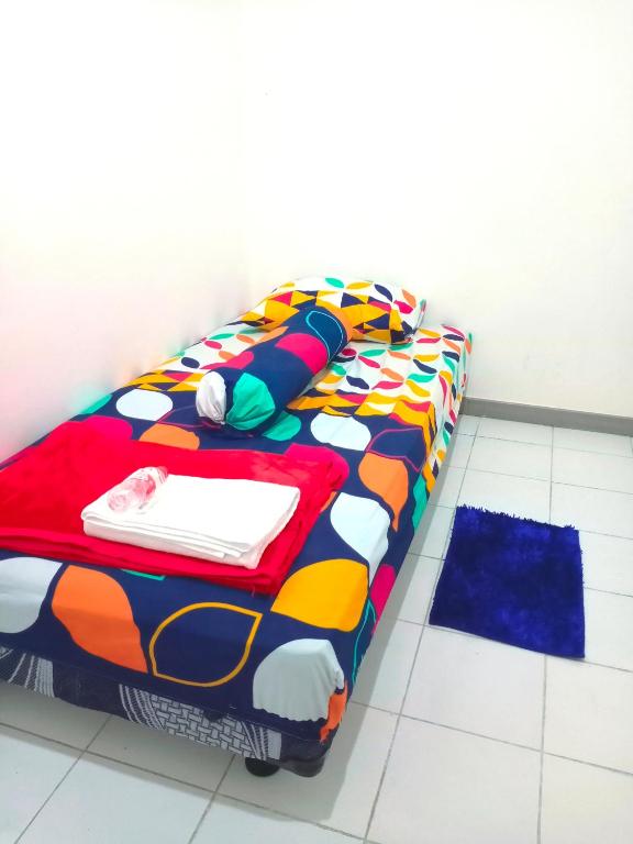 Postel nebo postele na pokoji v ubytování Hotel Nalendra Plaza Subang