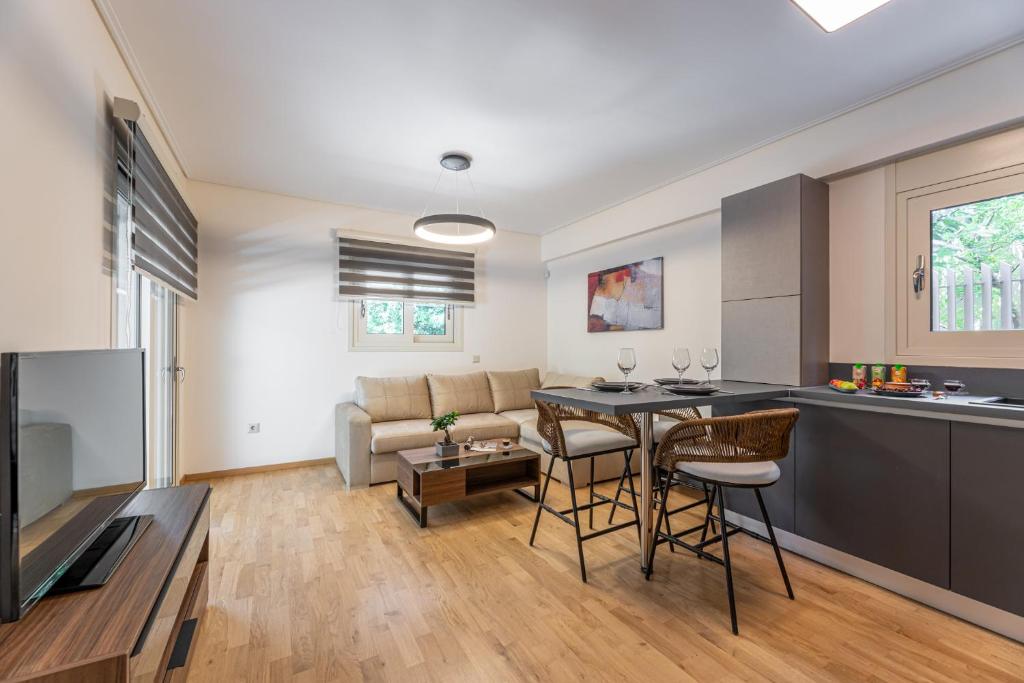 A television and/or entertainment centre at Olygreen Athens Residences