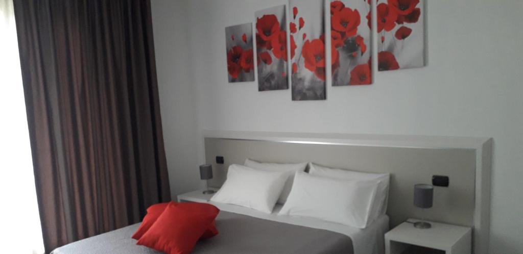 Postel nebo postele na pokoji v ubytování B&B I Tre Olivi