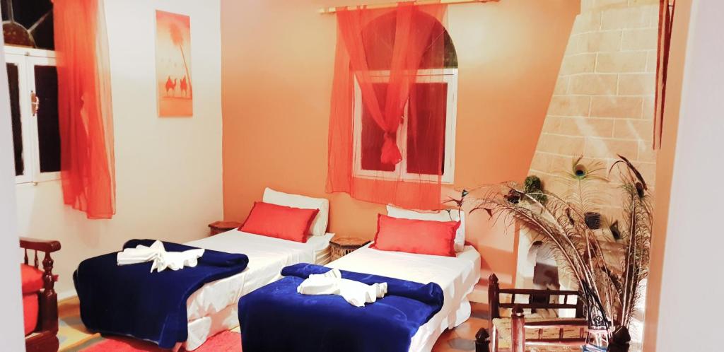 Postel nebo postele na pokoji v ubytování Camping & Hôtel Le Calme