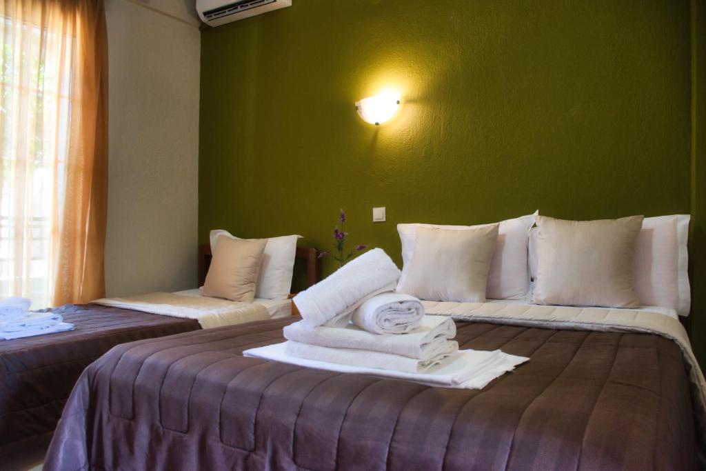 Postel nebo postele na pokoji v ubytování Hotel Barracuda