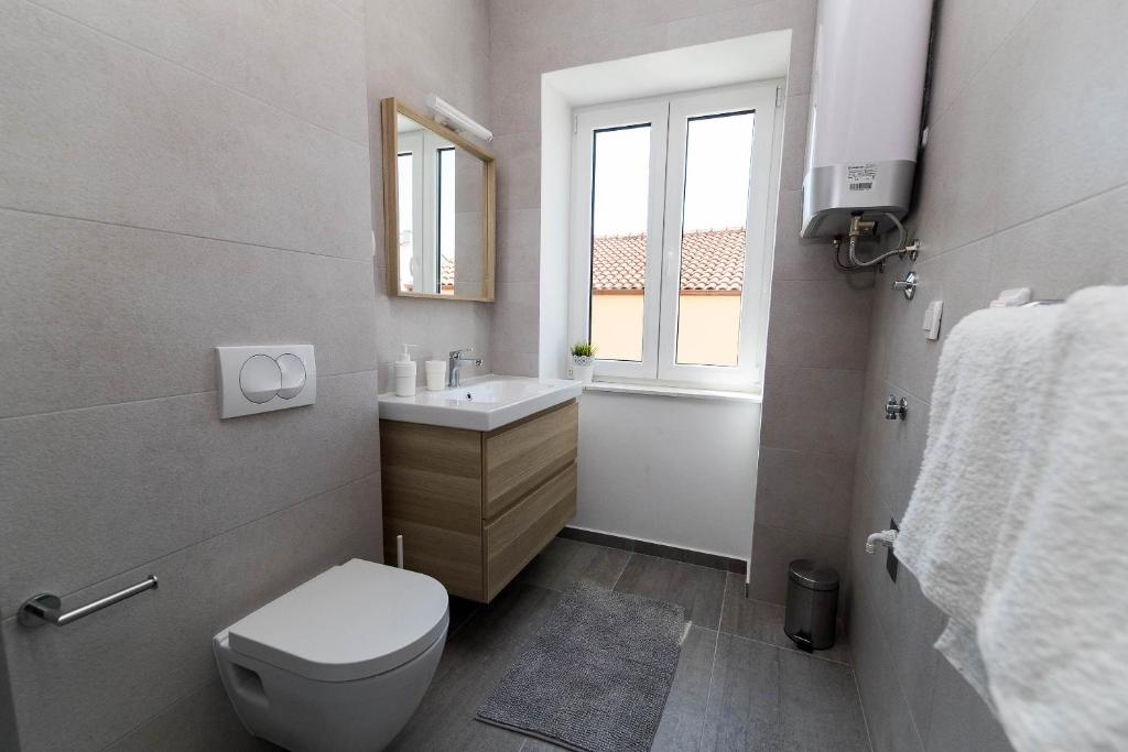 Kúpeľňa v ubytovaní APARTMANI VIGO