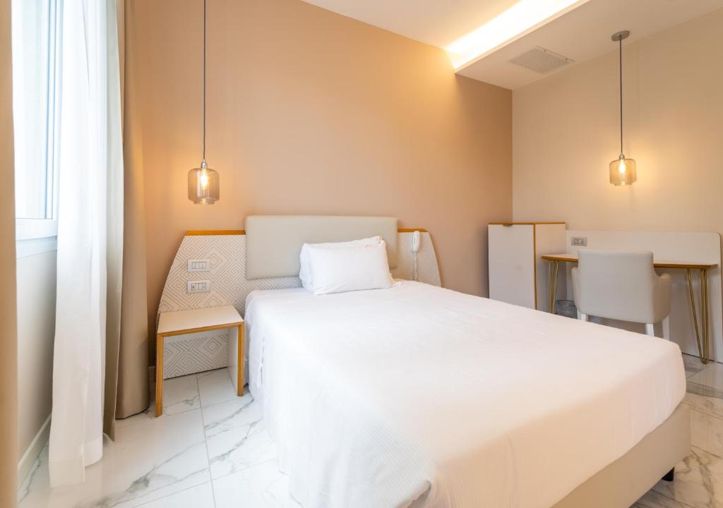 Postel nebo postele na pokoji v ubytování Hotel Milano Castello