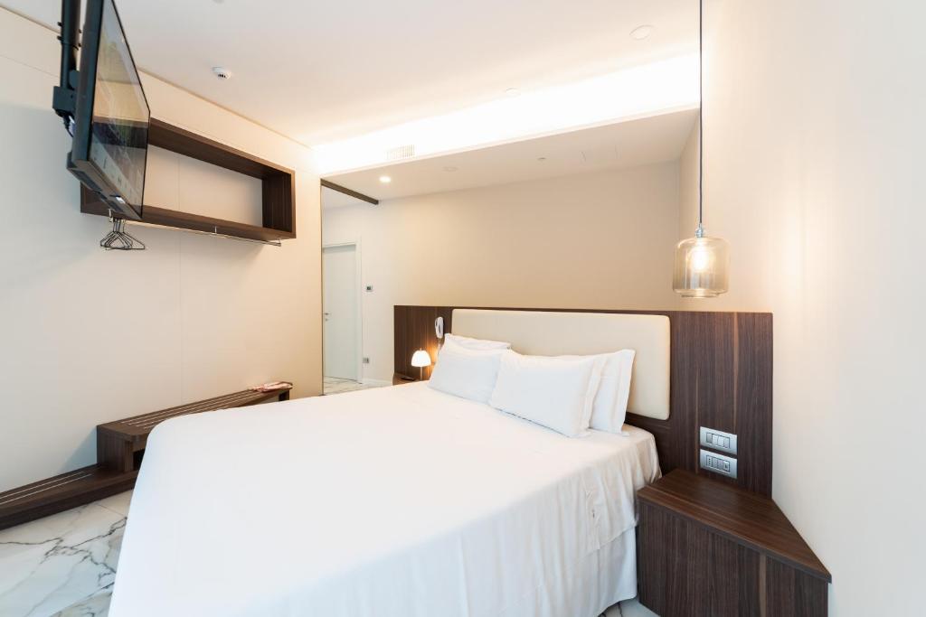 Postel nebo postele na pokoji v ubytování Hotel Milano Castello