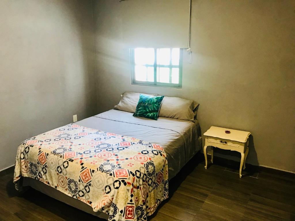 מיטה או מיטות בחדר ב-CASA MALIX Puerto Morelos