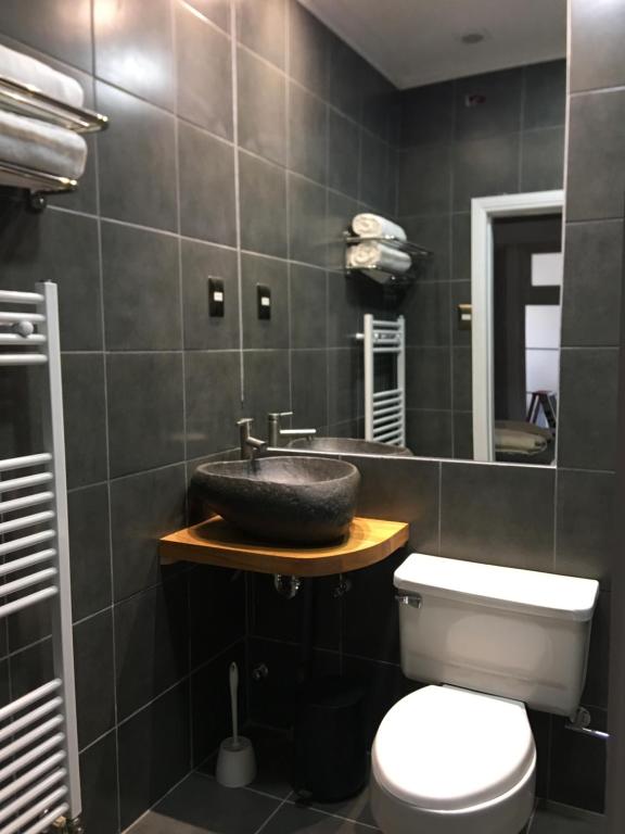 Koupelna v ubytování Hostal Boutique Puerta Roja